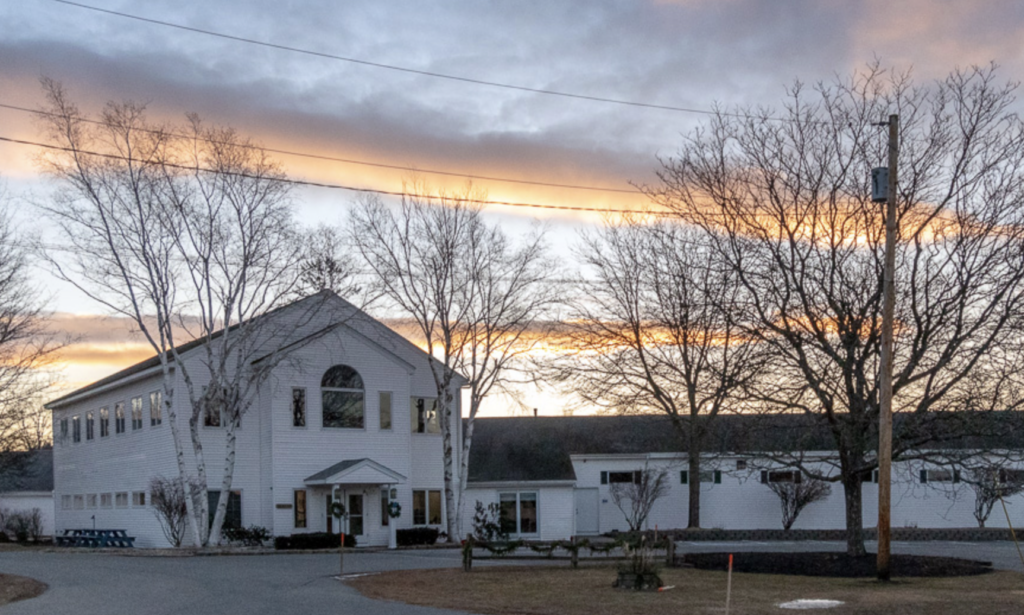 Schoolhouse with beautiful sky and clouds in the background